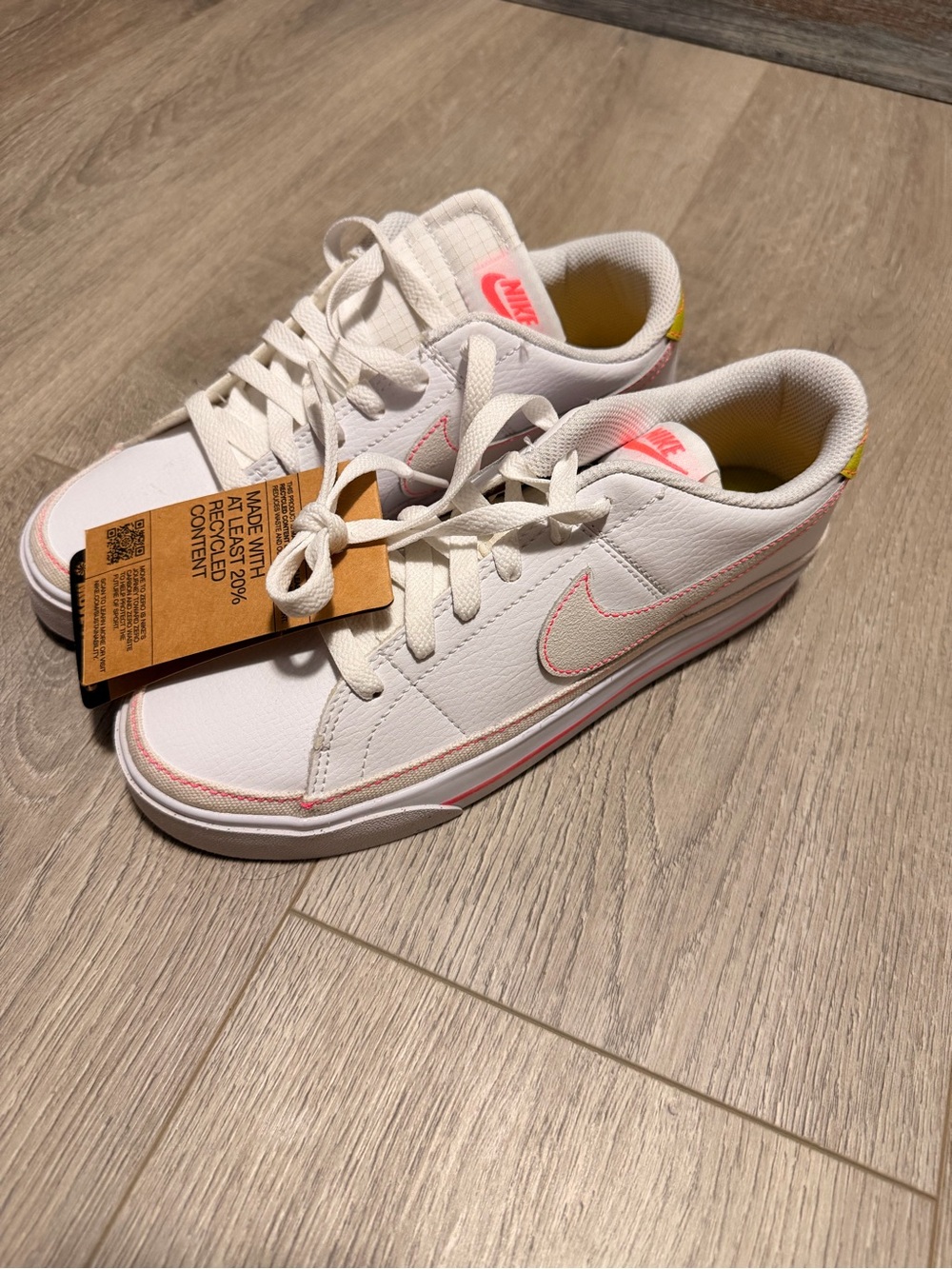 Nike Women's Low-Top Sneakers in White with Pink and Yellow Accents
